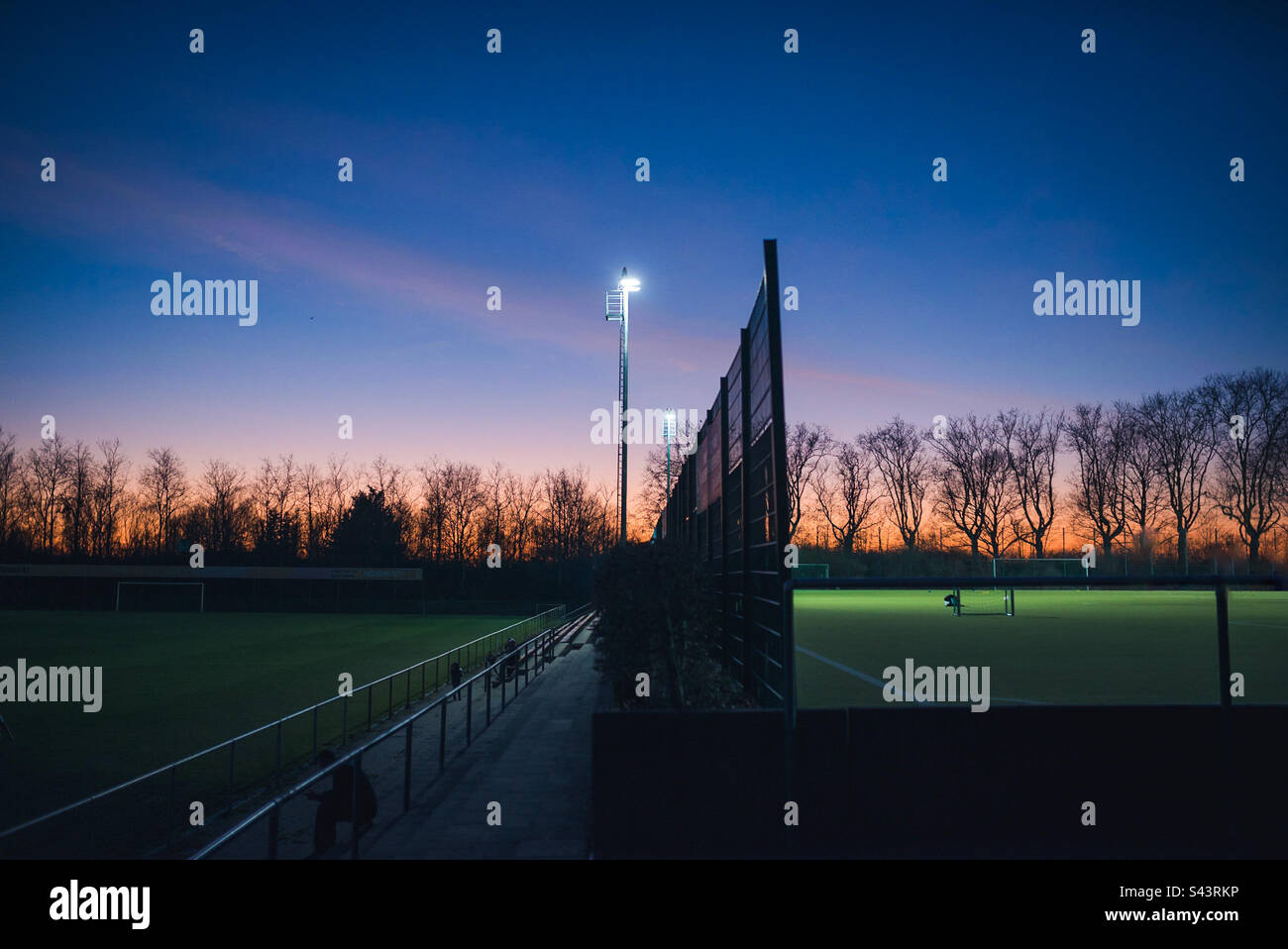 Sport field lit up in the evening. - Smartphone Captured Stock Image