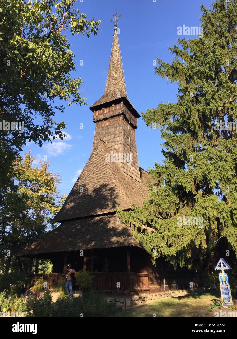 King Michael I Park, Bucharest, Romania. Traditional homes, churches and other constructions brought together from across Romania’s different regions. - Smartphone Captured Stock Image