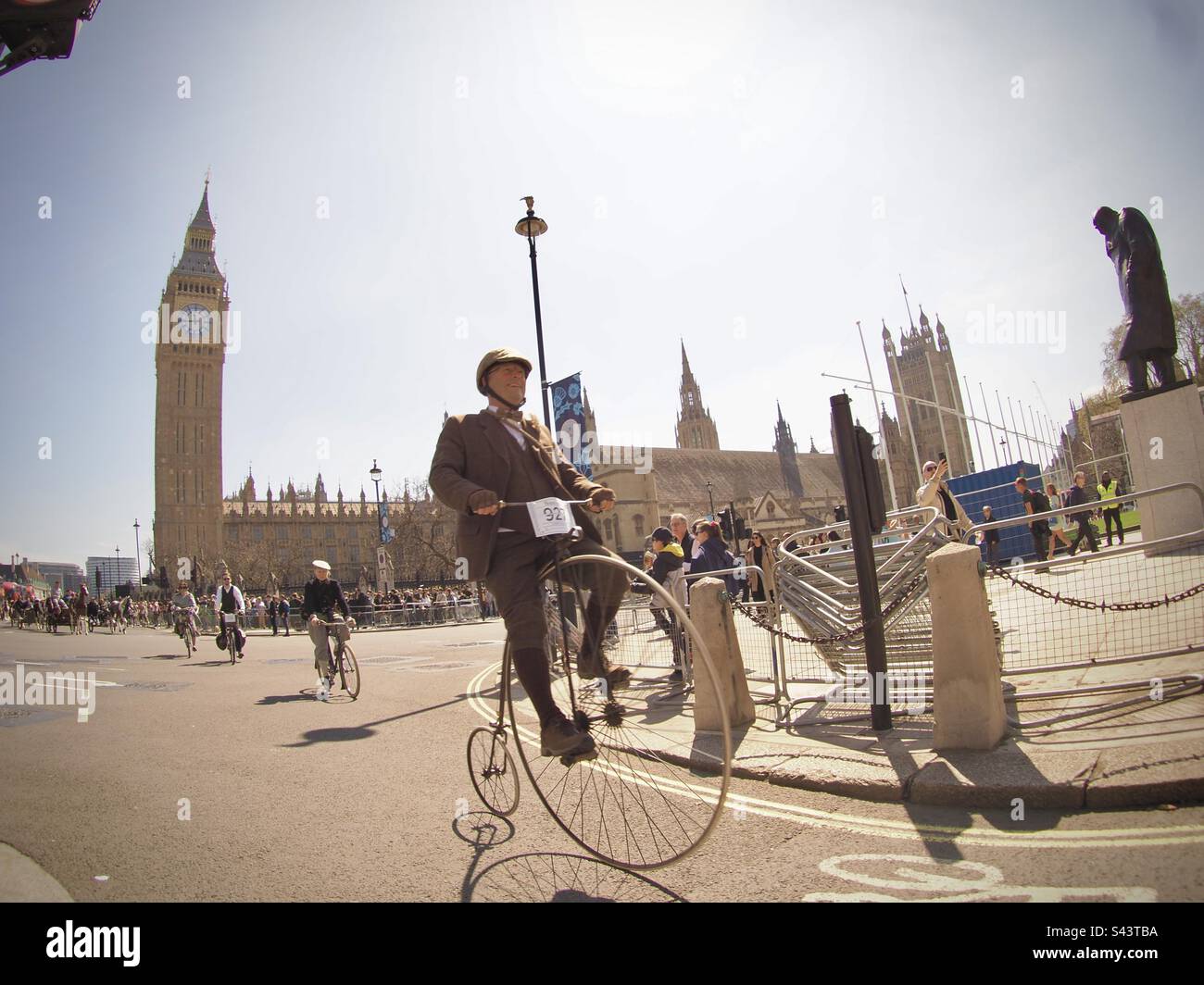 Penny Farthing rider in front of Big Ben and the Houses of Parliament. London Tweed Run 2023 Stock Photo