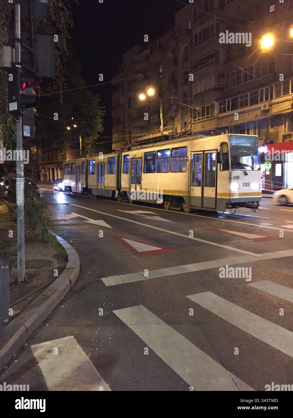 Bucharest, Romania. Street scene with passing tram. Public transport in Bucharest. - Smartphone Captured Stock Image