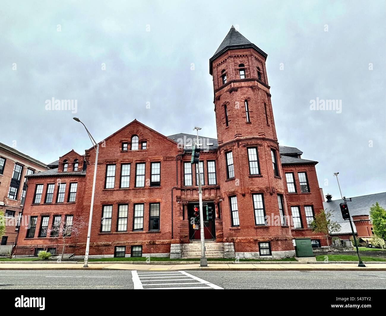 Worcester, Massachusetts, USA:  Exterior of old, red brick building in the center of town. Taken on a cloudy, spring day. Urban, streetscape concept of vintage architecture. - Smartphone Captured Stock Image