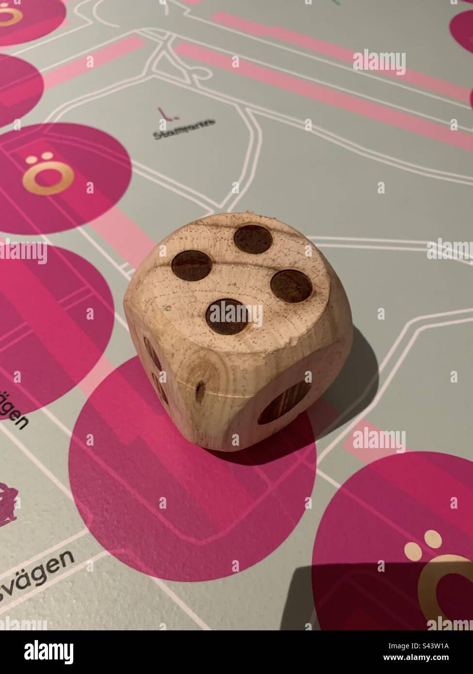 Big wooden dice with four up Stock Photo Alamy