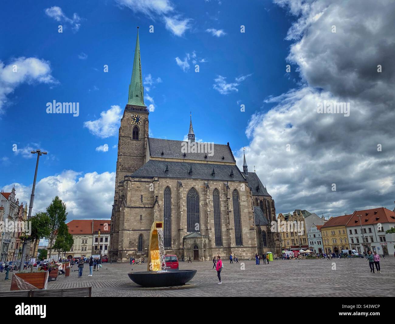 Cathedral of Saint Bartholomew and golden fountain on the Republic Square in Pilsen, Czech Republic. - Smartphone Captured Stock Image