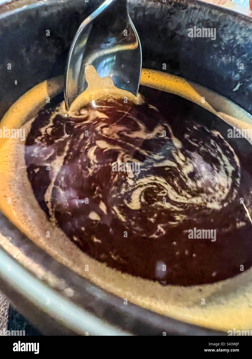 Stirring black coffee - Smartphone Captured Stock Image