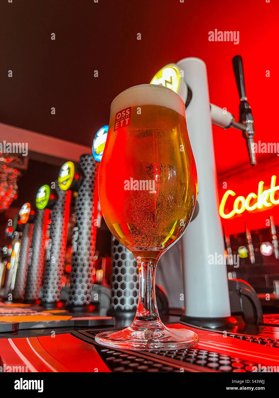 Pint of lager in trendy cocktail bar - Smartphone Captured Stock Image