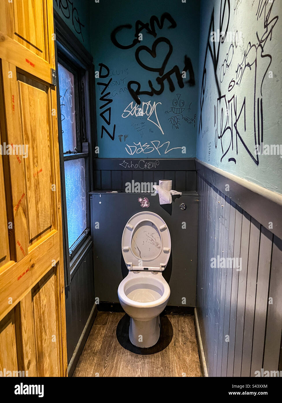 Inside toilet with lots of graffiti Stock Photo Alamy