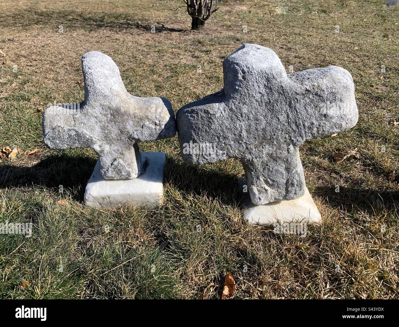 Two super cute natural stone carved crosses showing love after death. Stock Photo