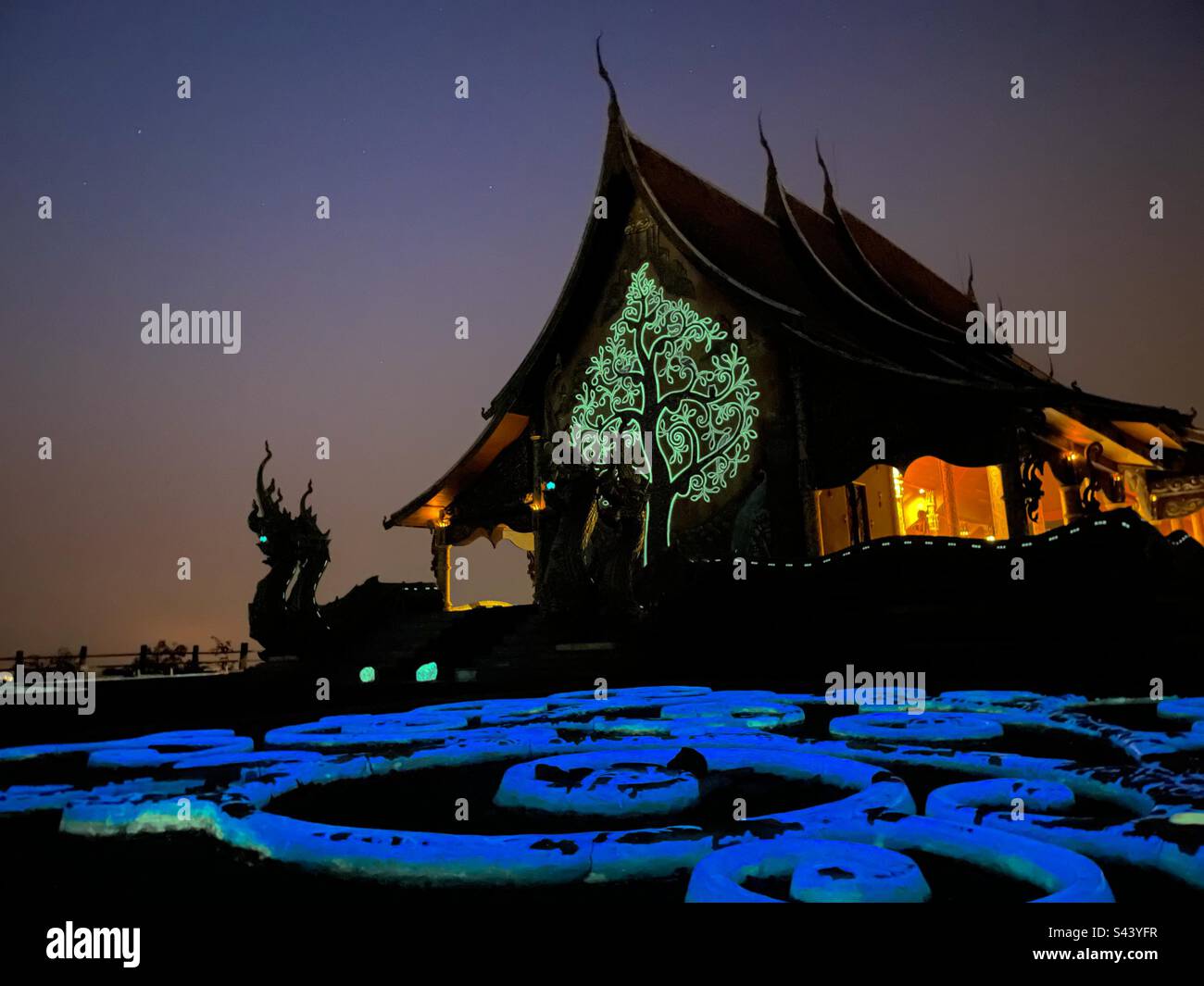 Glow in the dark temple in Thailand Stock Photo