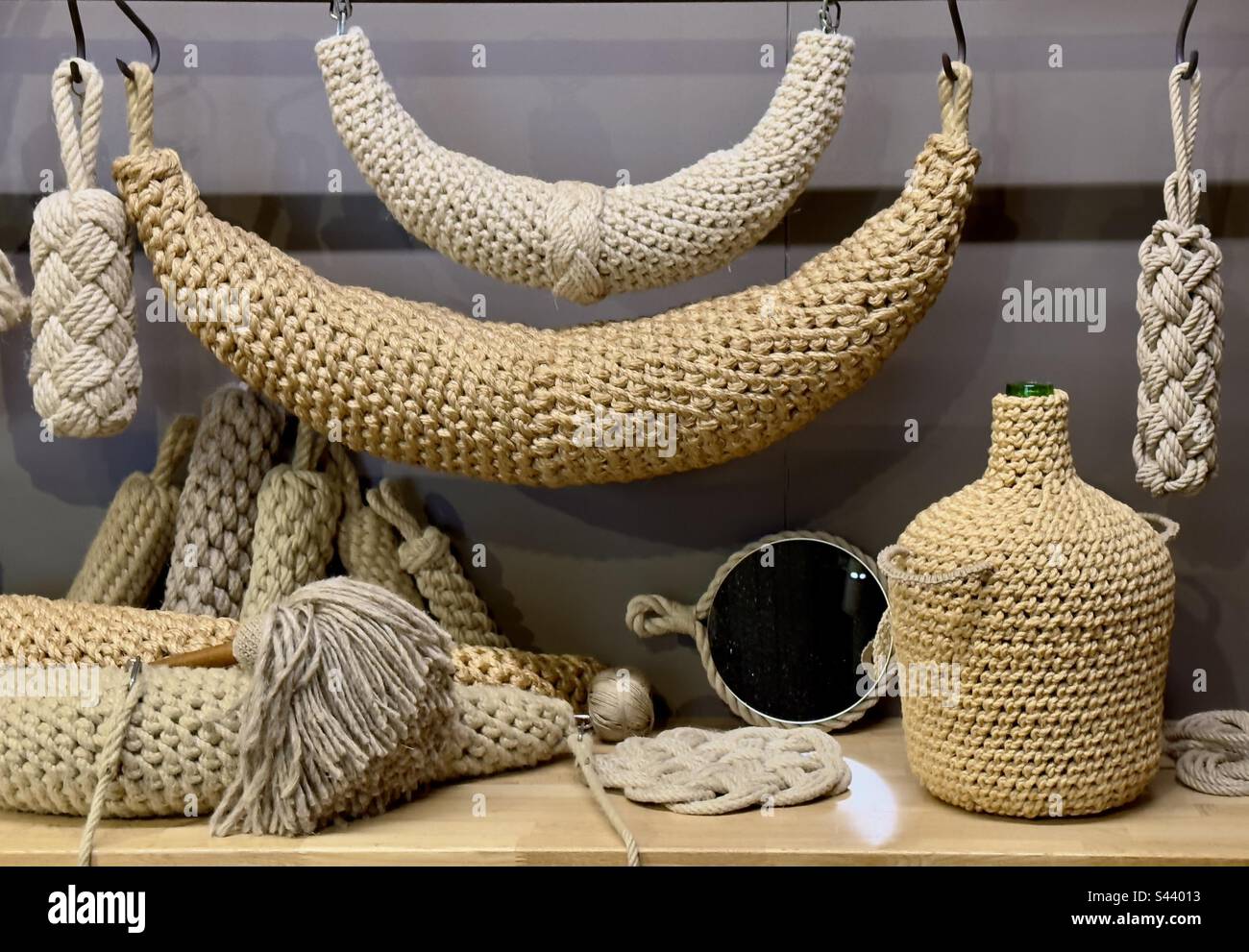 A collection of artefacts made from rope and string on display in the French rope works museum in Rochefort - Smartphone Captured Stock Image A collection of artefacts made from rope and string on display in the French rope works museum in Rochefort - Smartphone Captured Stock Image