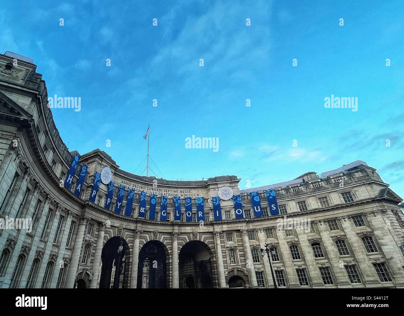 Perspective of Admiralty Arch decoration for coronation “Happy and Glorious” looks towards Buckingham Palace, London Stock Photo