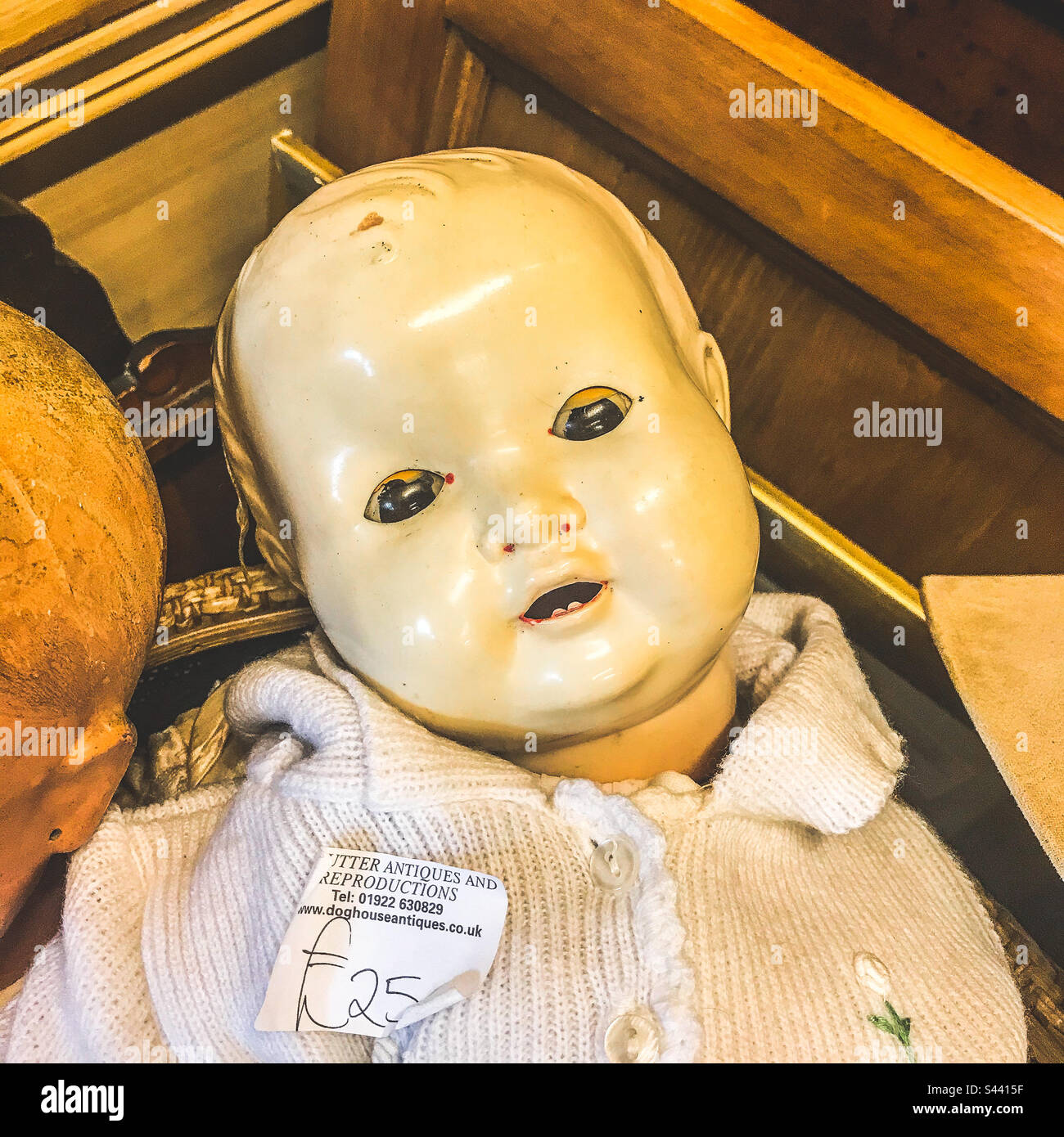 Junk shop creepy doll - Smartphone Captured Stock Image