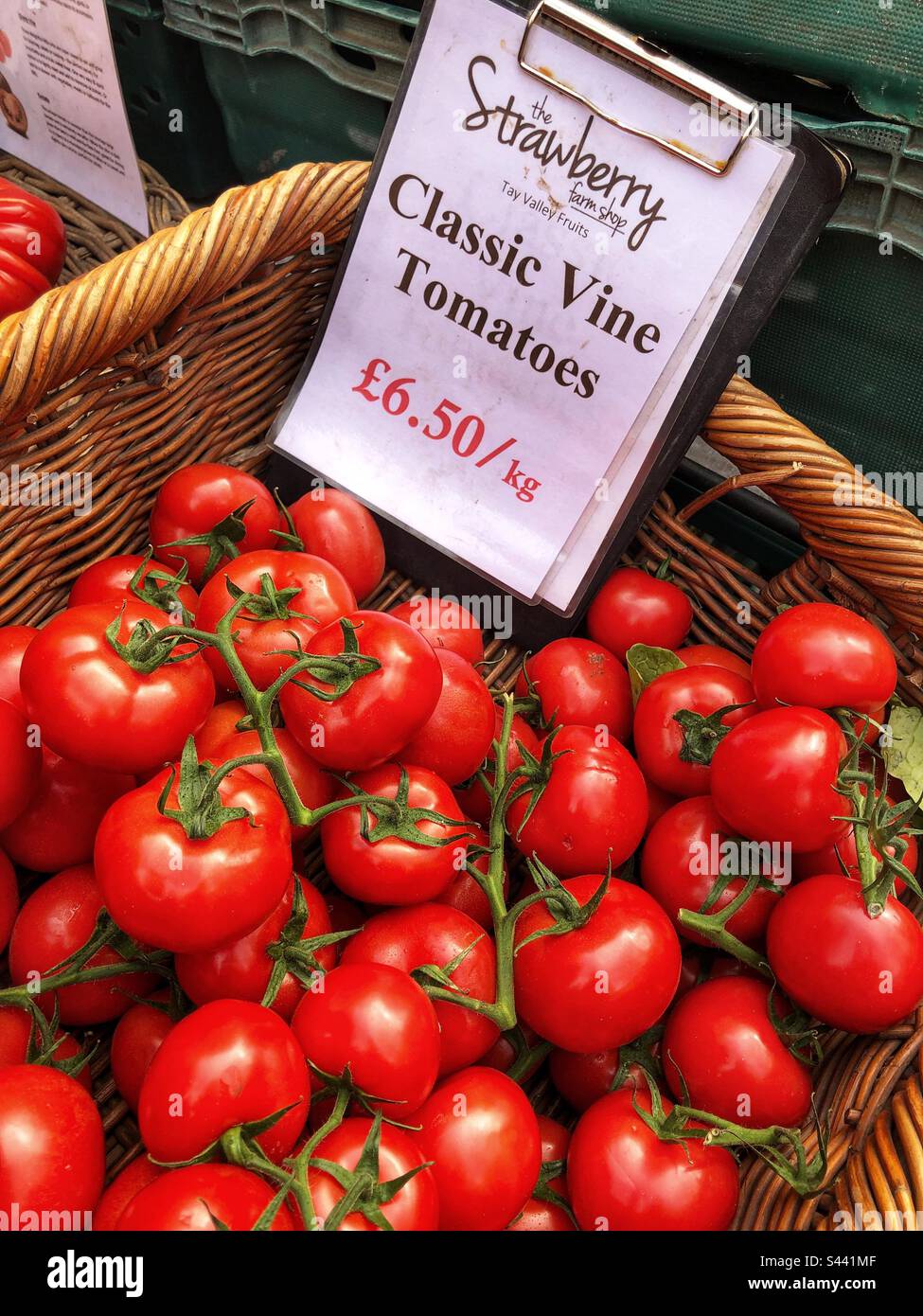 Classic Vine Tomatoes priced up for sale at a farmers market stall ...