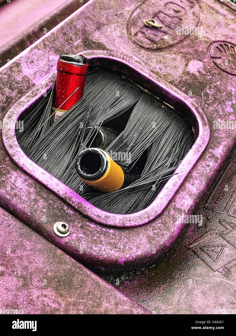 Overflowing glass bottle bank recycling bin on street - Smartphone Captured Stock Image