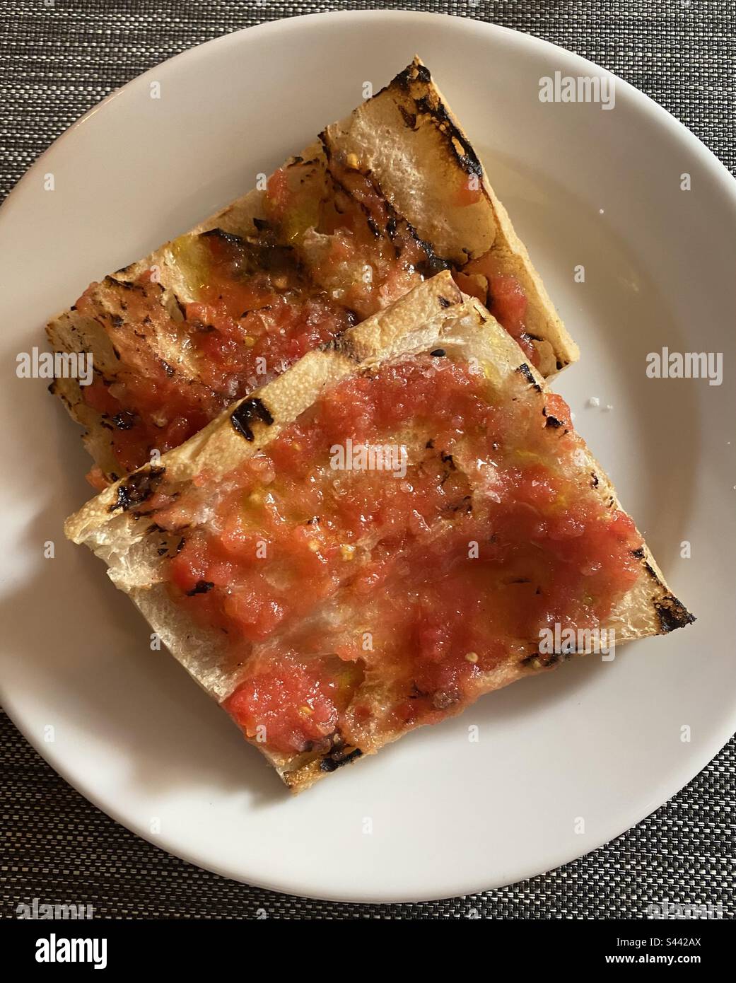 Pan con tomate at Güell Tapas, Barcelona, Cataluña, Spain. April 2023. - Smartphone Captured Stock Image