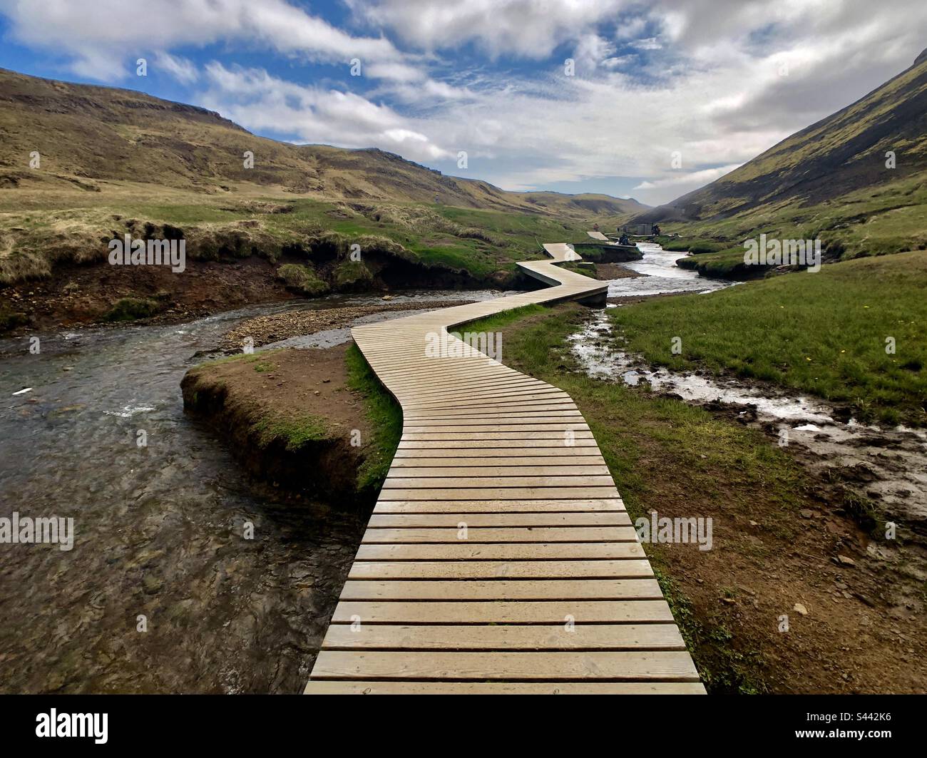 Makeshift wooden bridge over water Stock Photo - Alamy