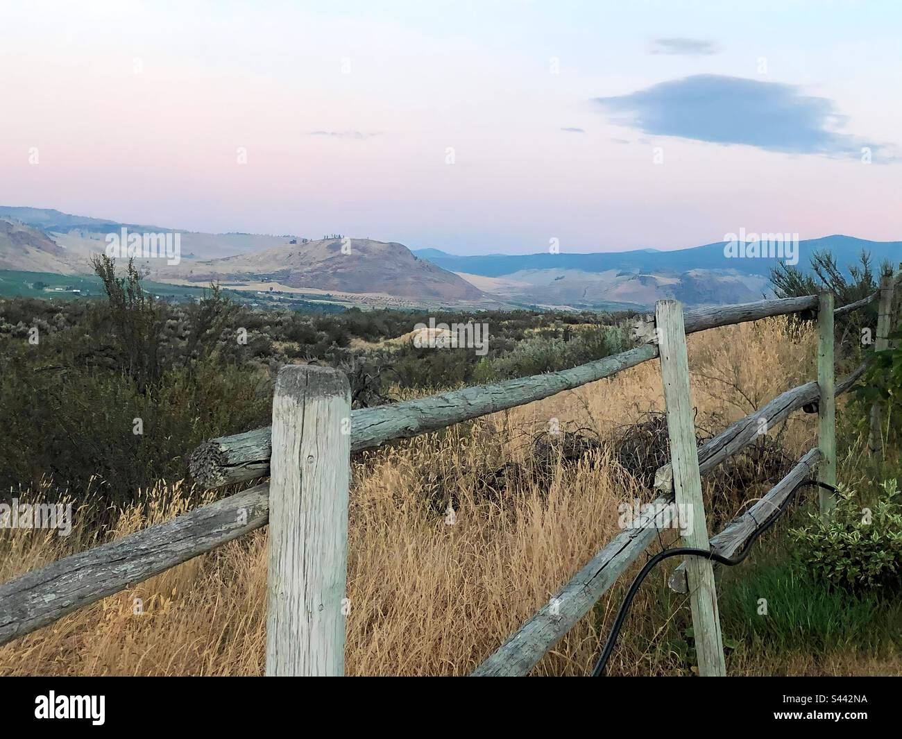 Fence line on a hill in Osoyoos BC - Smartphone Captured Stock Image
