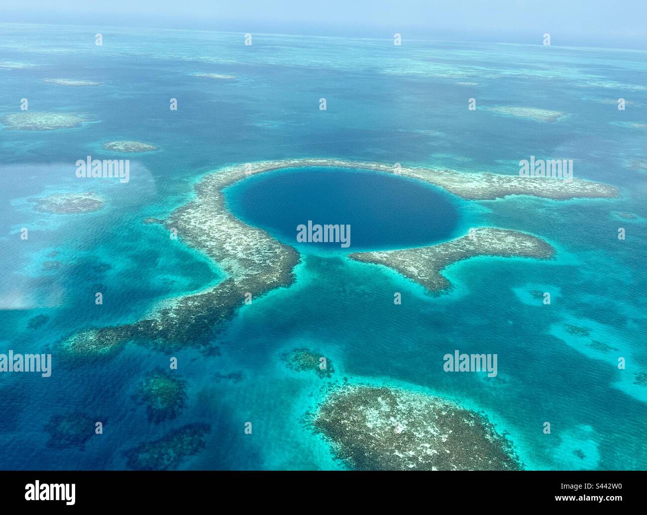 Scenic flight over the Blue Hole, Belize Stock Photo