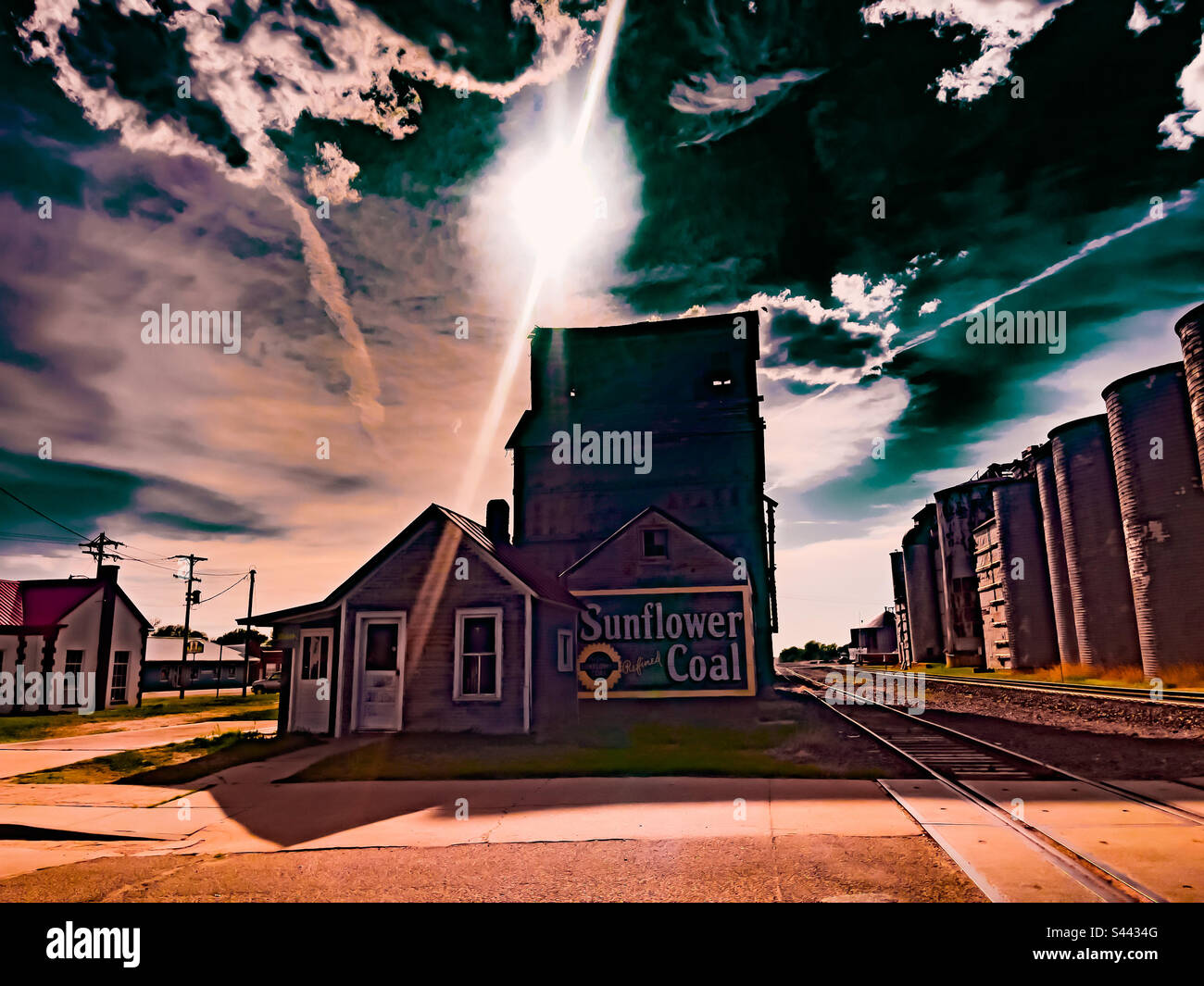 Small rural town tucked off of I-70, coal and grain elevator, edit makes for a painted look Stock Photo