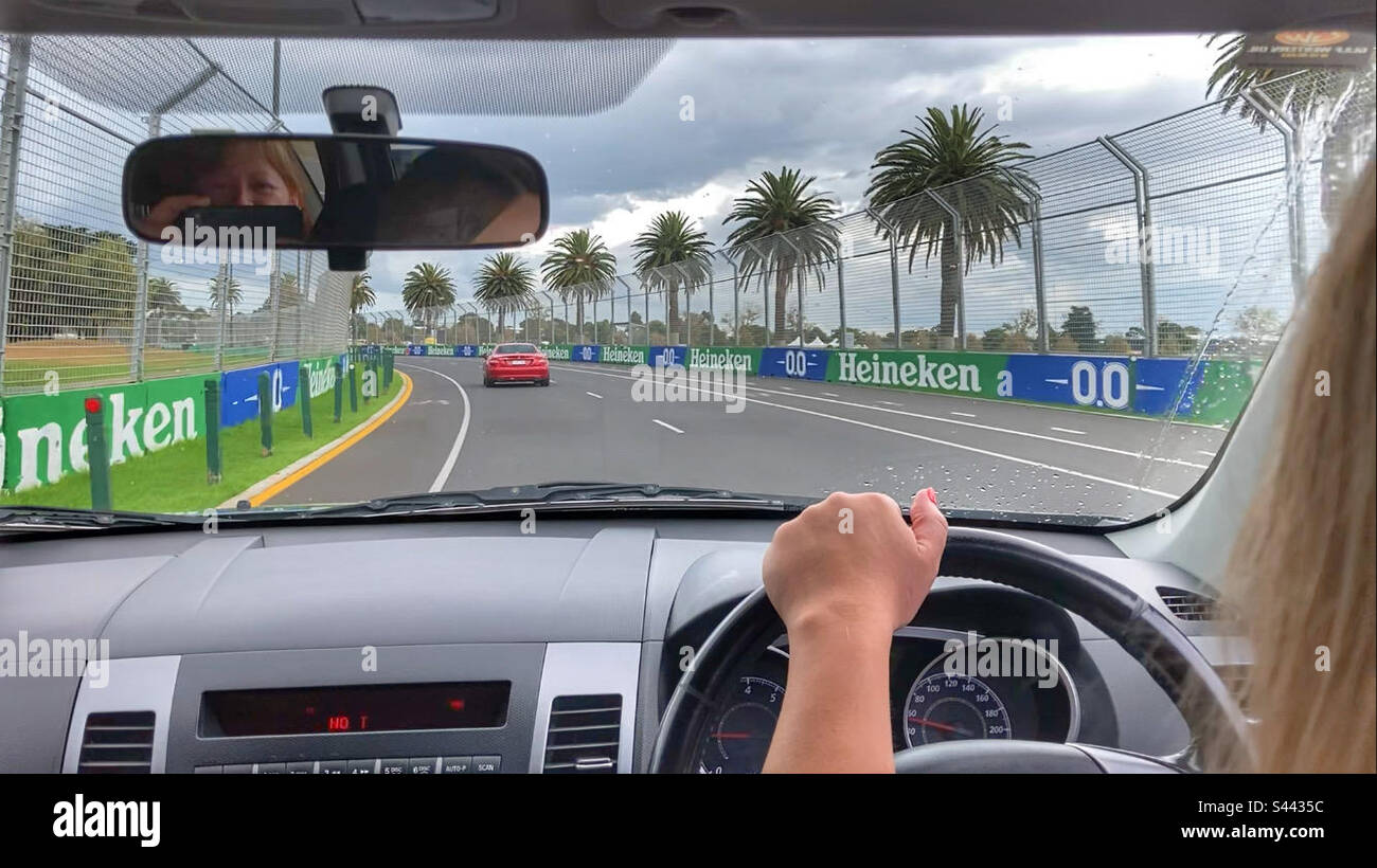 Woman driving on Albert Park Grand Prix Circuit Melbourne Victoria Australia - Smartphone Captured Stock Image