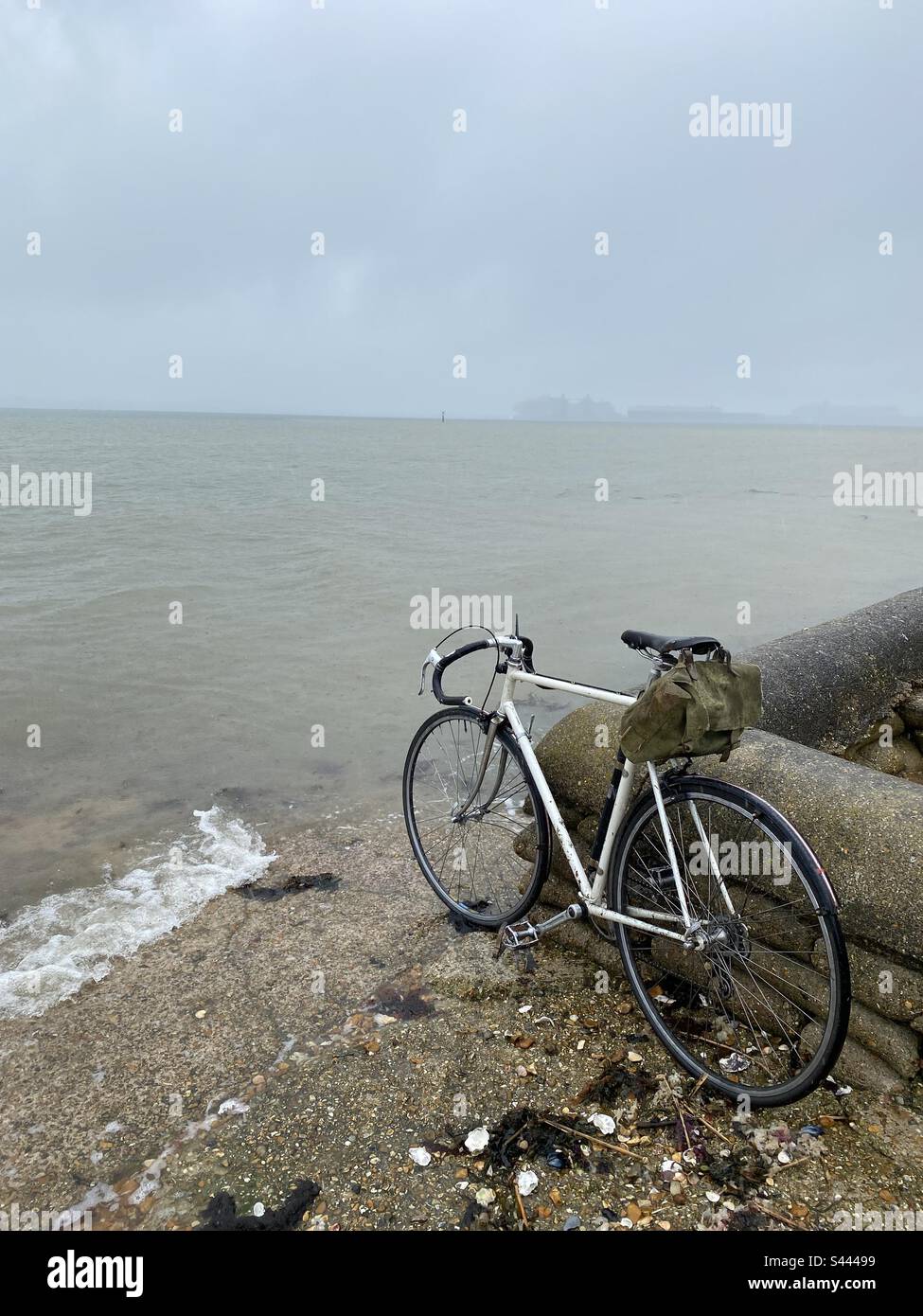 Bicycle at the waters edge Stock Photo
