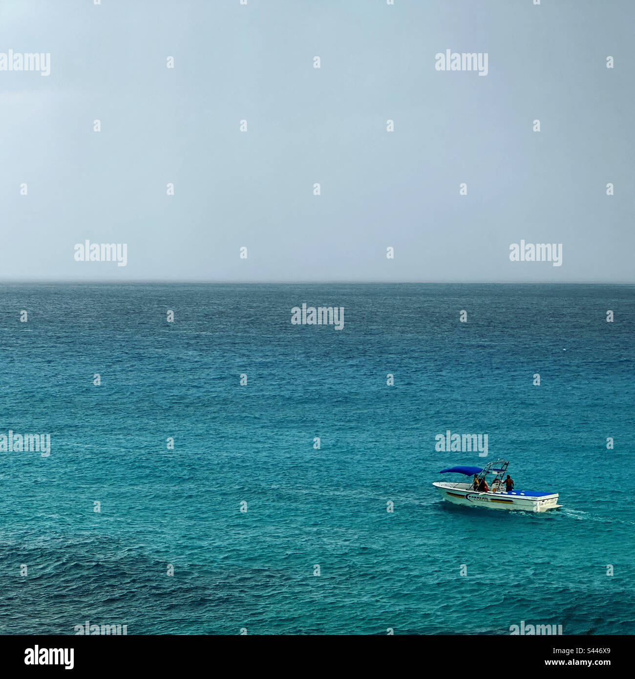 A small boat in the rain, Cancun, Quintana Roo, Yucatan Peninsula, Mexico - Smartphone Captured Stock Image