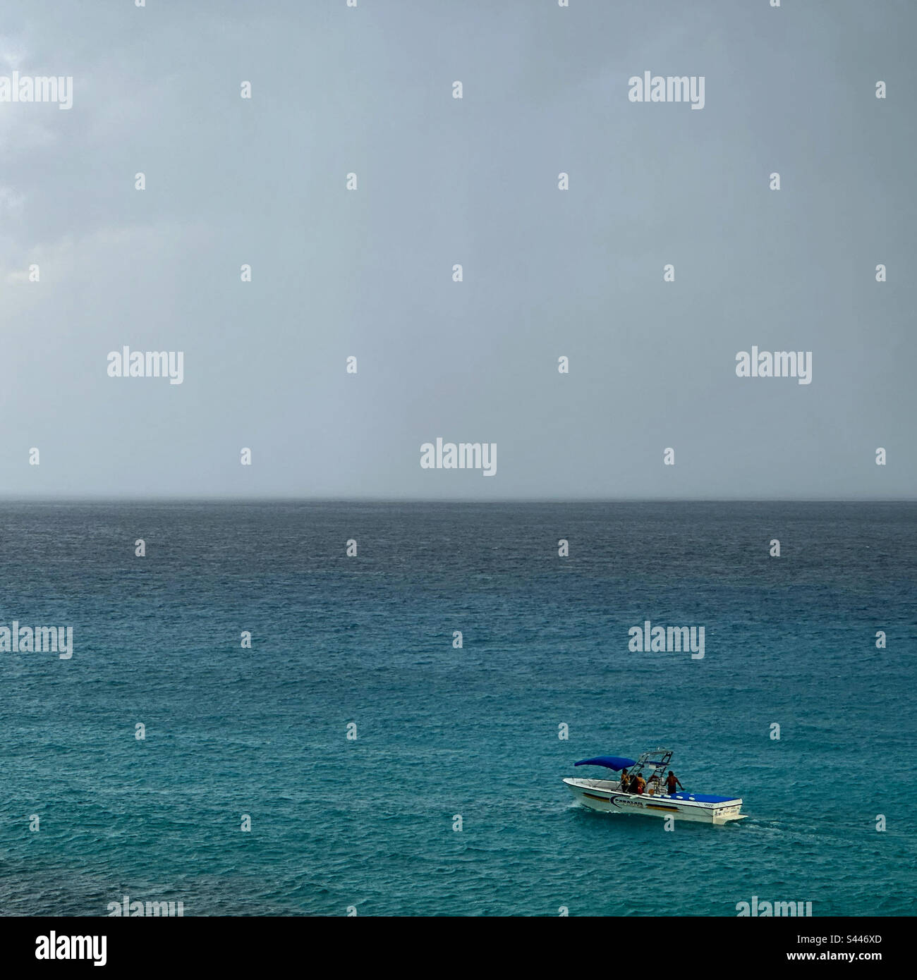 A small boat in the rain, Cancun, Quintana Roo, Yucatan Peninsula, Mexico - Smartphone Captured Stock Image