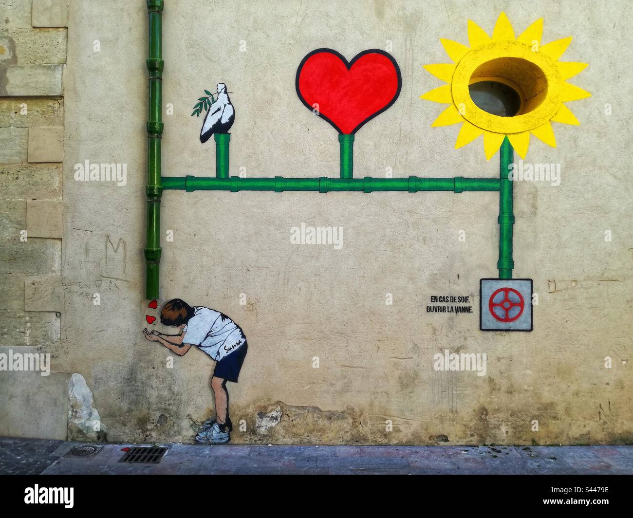 Graffiti by Sunra Artist in Serignan village. Occitanie, France - Smartphone Captured Stock Image