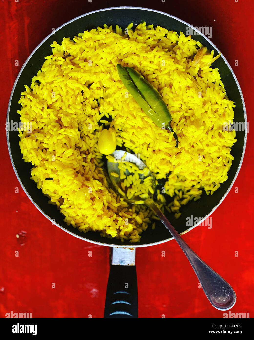 Yellow rice, a green serrano hot chilli pepper in Queretaro, Mexico Stock Photo