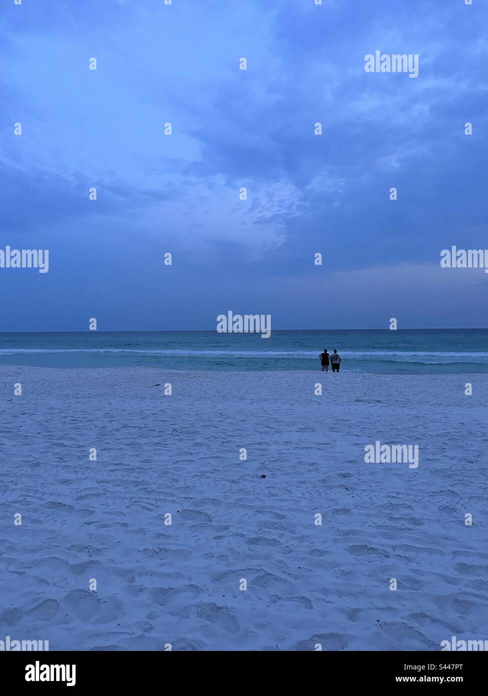 People watching late evening sunset over the Gulf of Mexico Florida USA May 2023 - Smartphone Captured Stock Image