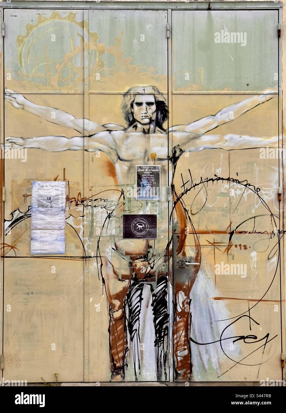 Metal doors of a French dance school, who is in graffiti based upon Leonardo da Vinci’s drawing, but now representing a centaur - Smartphone Captured Stock Image