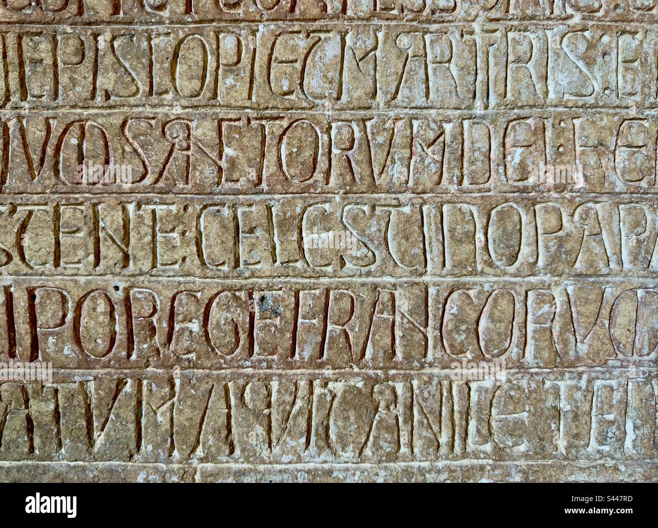 A 12th century inscription in a church in the Dordogne in France. A fine example of mediaeval letter cutting - Smartphone Captured Stock Image