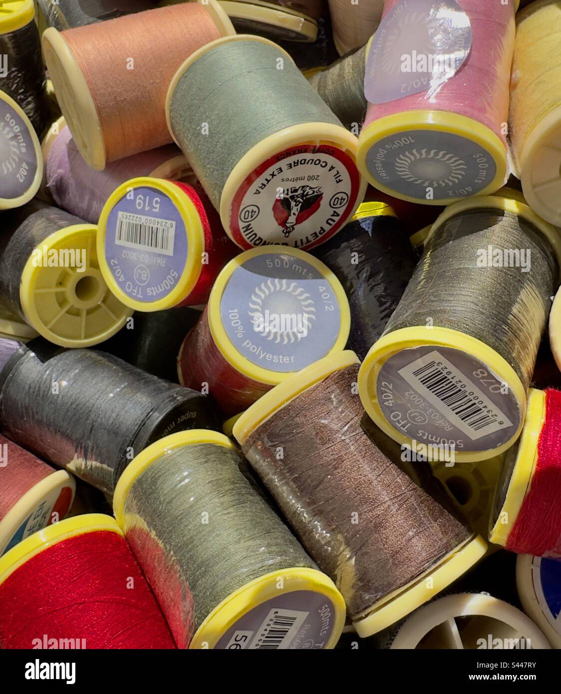 Reels of sewing thread for sale in a French Street market Stock Photo