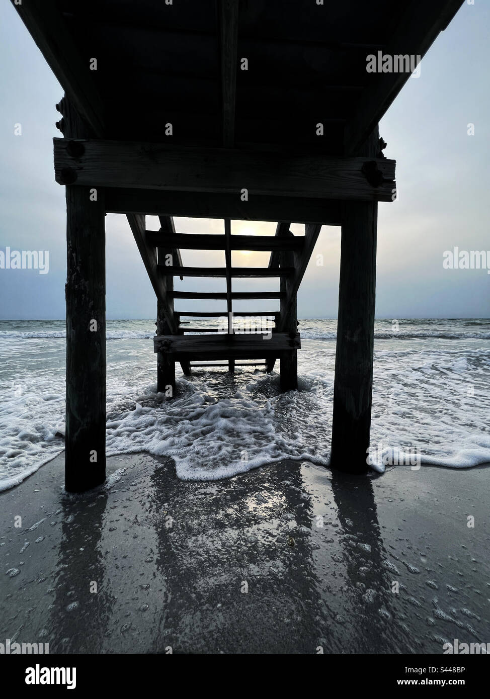 Silhouette of pier into ocean - Smartphone Captured Stock Image