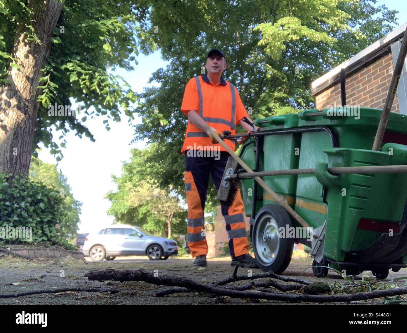 Serco council street cleaner in hi vis uniform Stock Photo Alamy