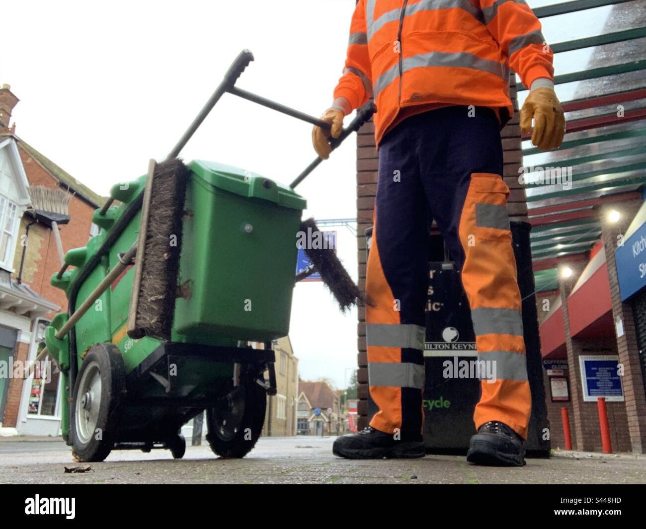 Serco street cleaner in hi vis uniform Stock Photo Alamy