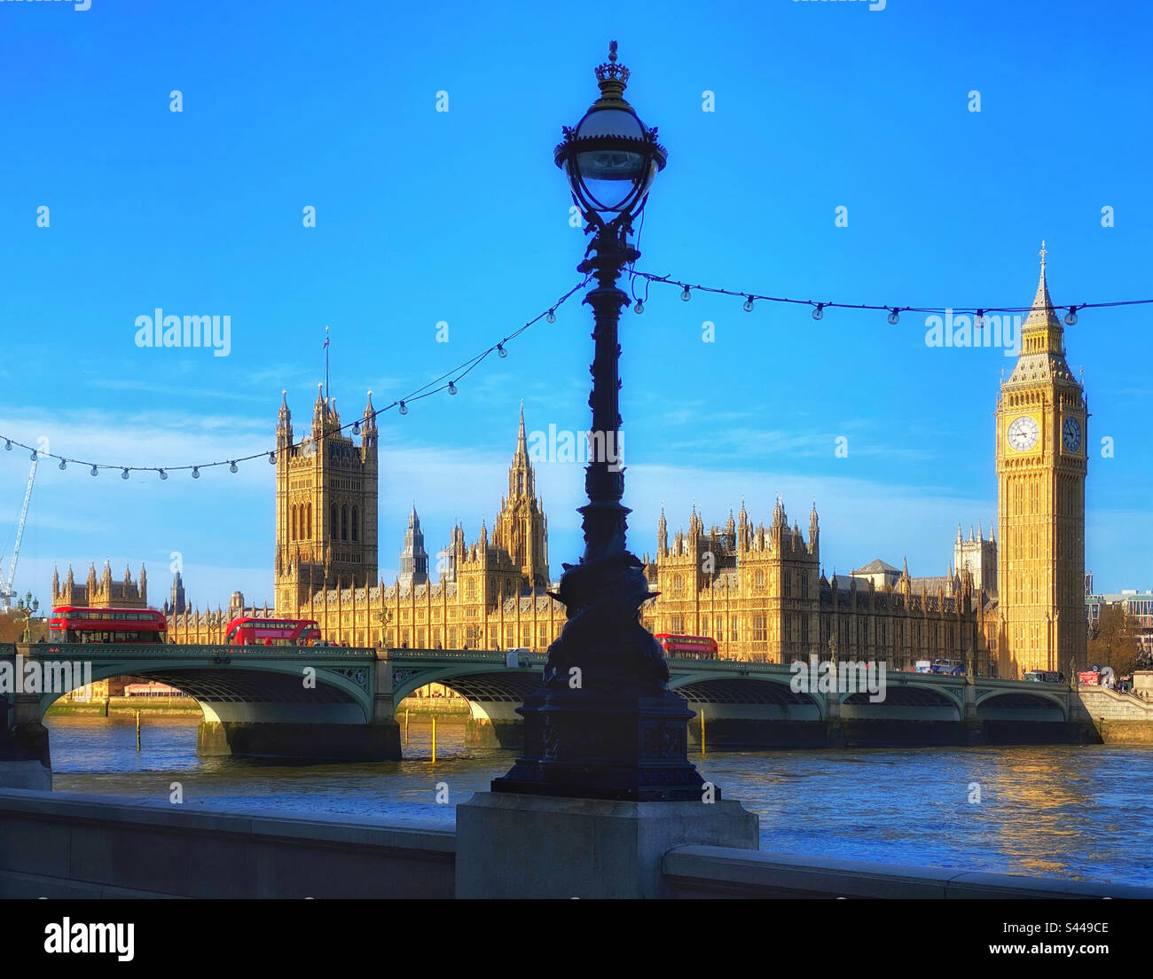 A view of Westminster Bridge over the River Thames, the Houses of Parliament, Big Ben, the famous Elizabethan Tower-a famous London view popular with tourists visiting England. Photo ©️ COLIN HOSKINS - Smartphone Captured Stock Image