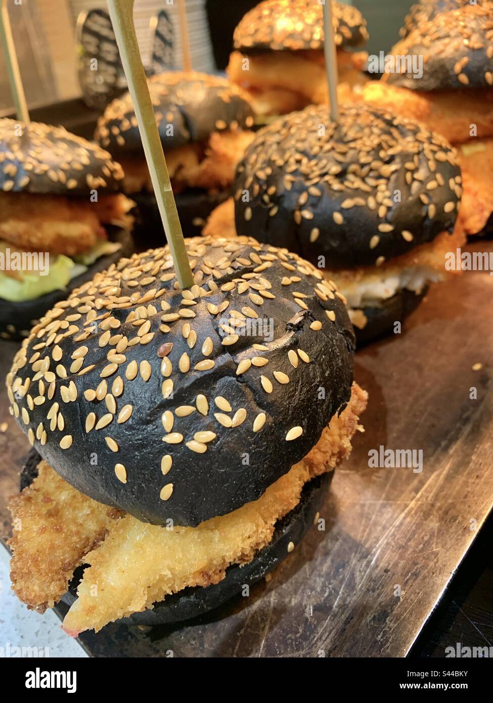 Black charcoal sesame seed burger bun Stock Photo Alamy