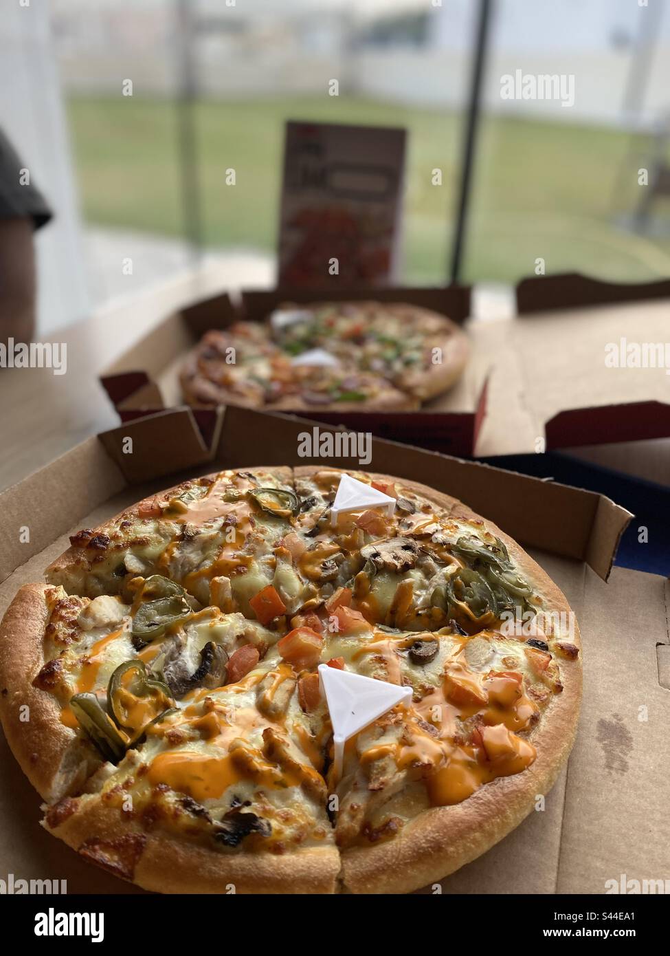 Oven fresh pizzas with boxes Stock Photo Alamy