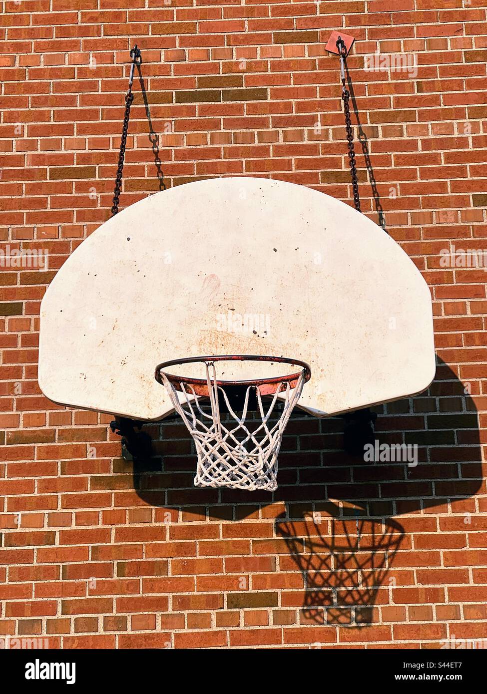 Basketball backboard and hoop on brick wall Stock Photo Alamy