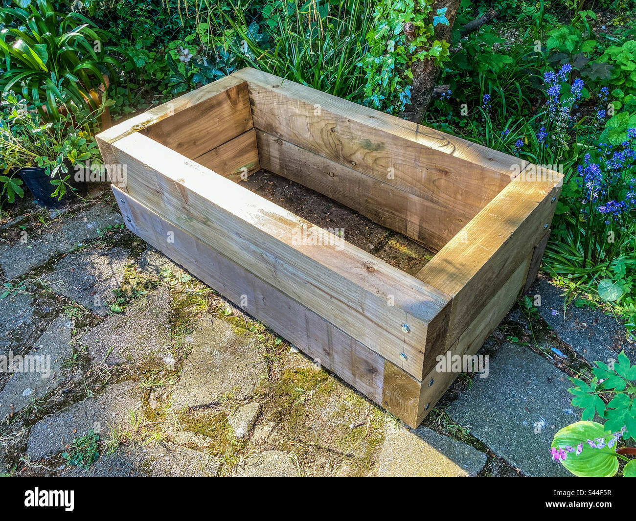 Second tier of my raised-bed, made from railroad sleepers, complete - Smartphone Captured Stock Image