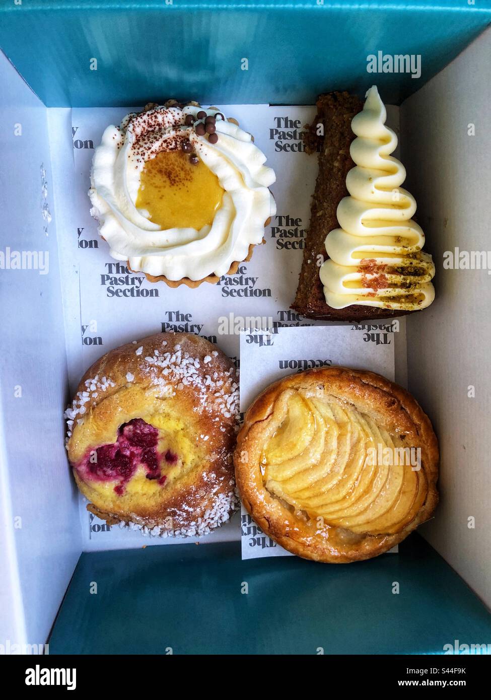 Speciality handmade cakes in box - Smartphone Captured Stock Image