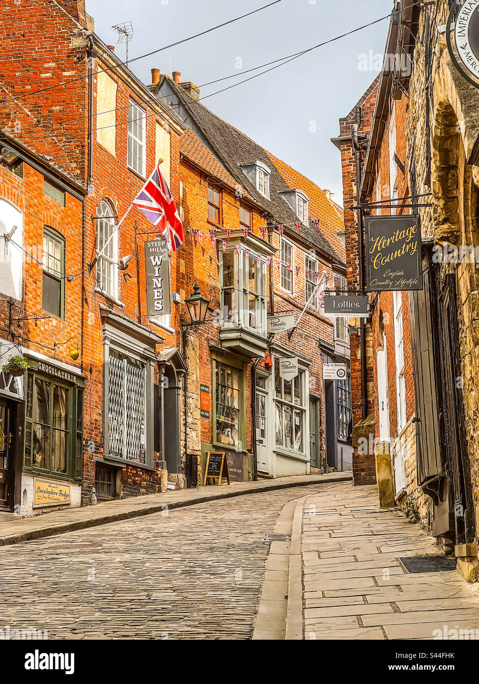 Old shops and cobbled stones. Historic Steep Hill, Lincoln, Lincolnshire, England. - Smartphone Captured Stock Image