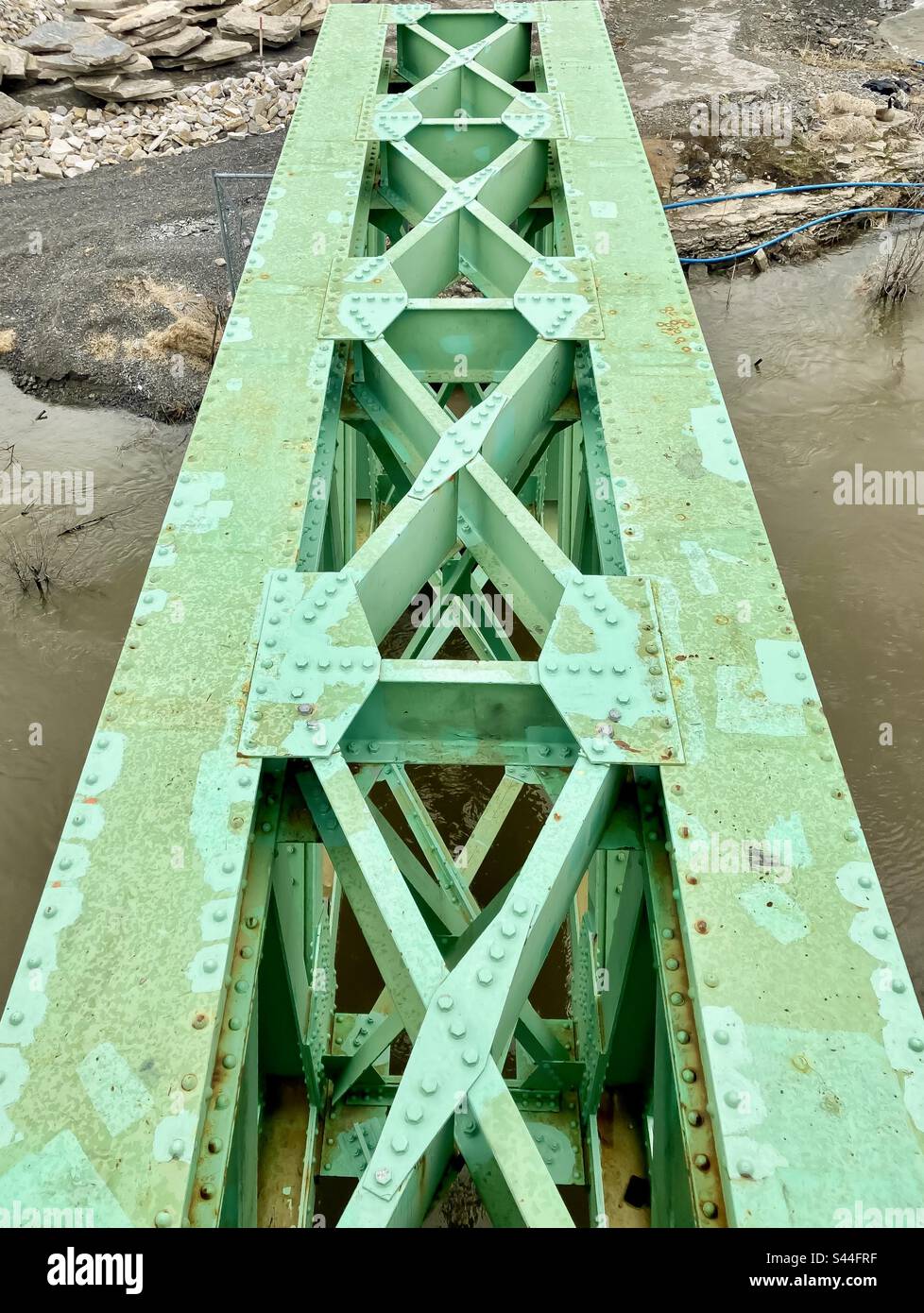 Dirty mint green bridge support. Stock Photo