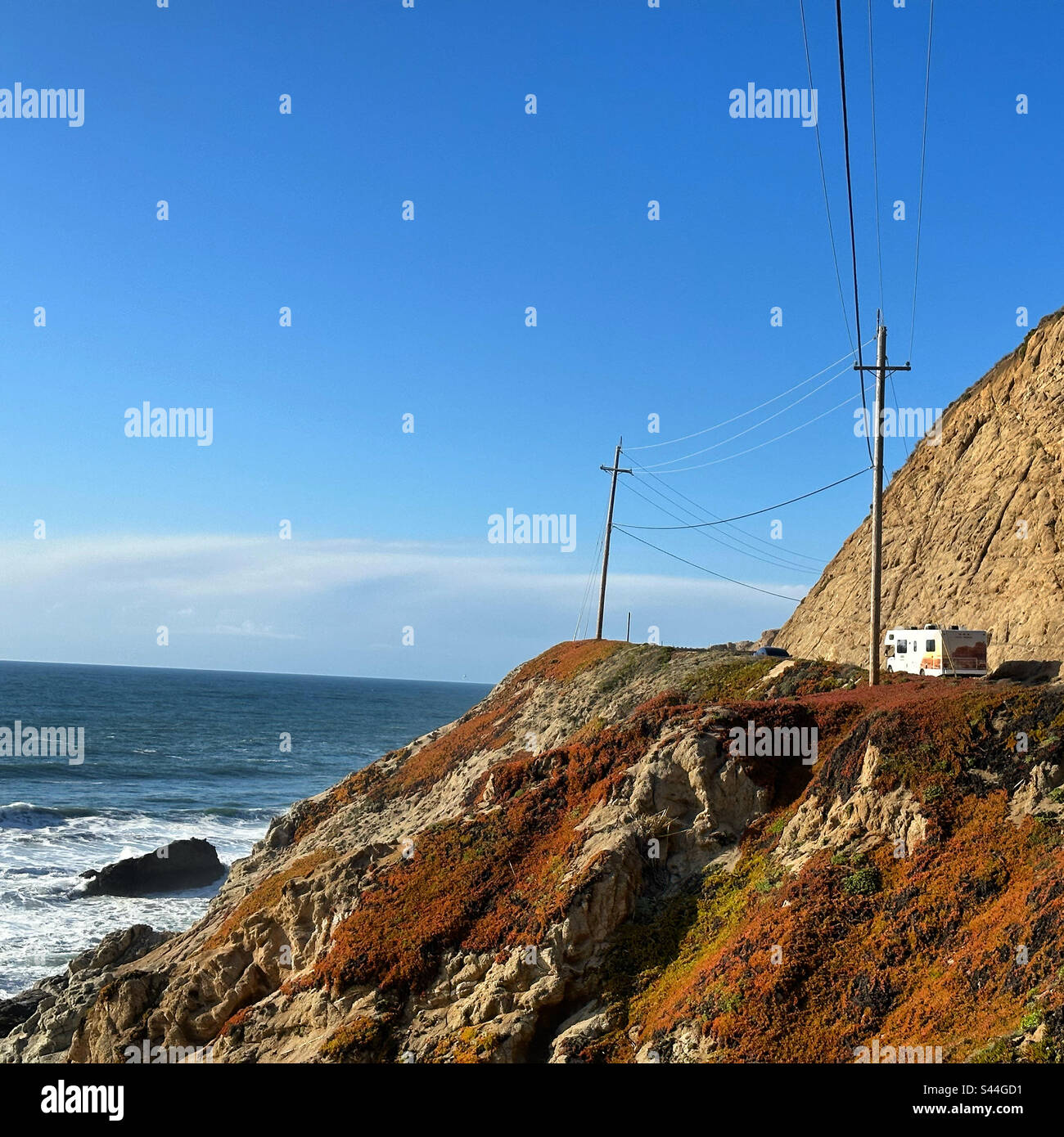 March, 2023, An RV driving on Highway 1, overlooking Montara State Beach, San Mateo County, California, United States - Smartphone Captured Stock Image