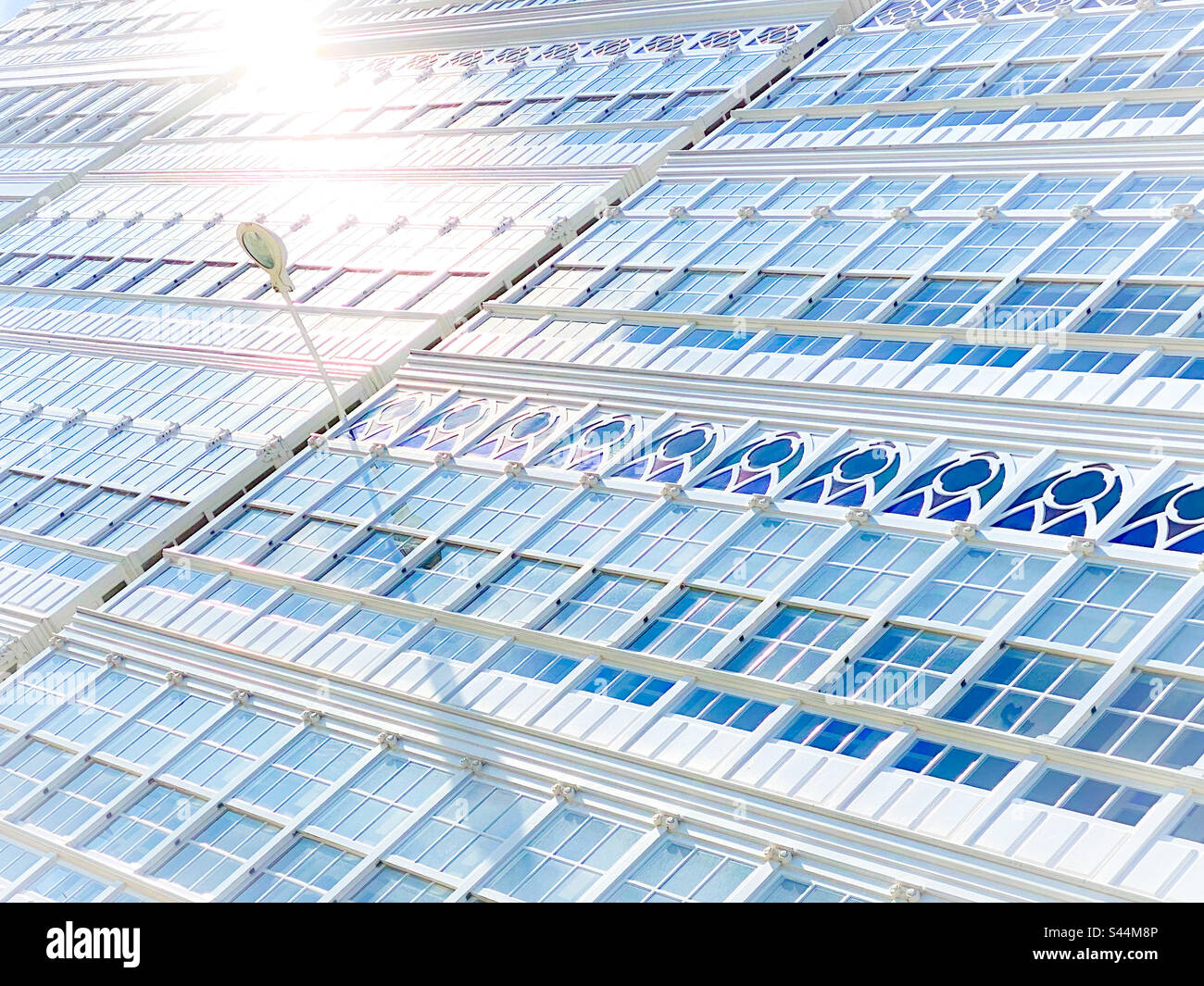 Typical glass facade (enclosed glass balconies) of the city of La Coruna (La Coruña) in Spain, wich gives it the name of City of Glass - Smartphone Captured Stock Image