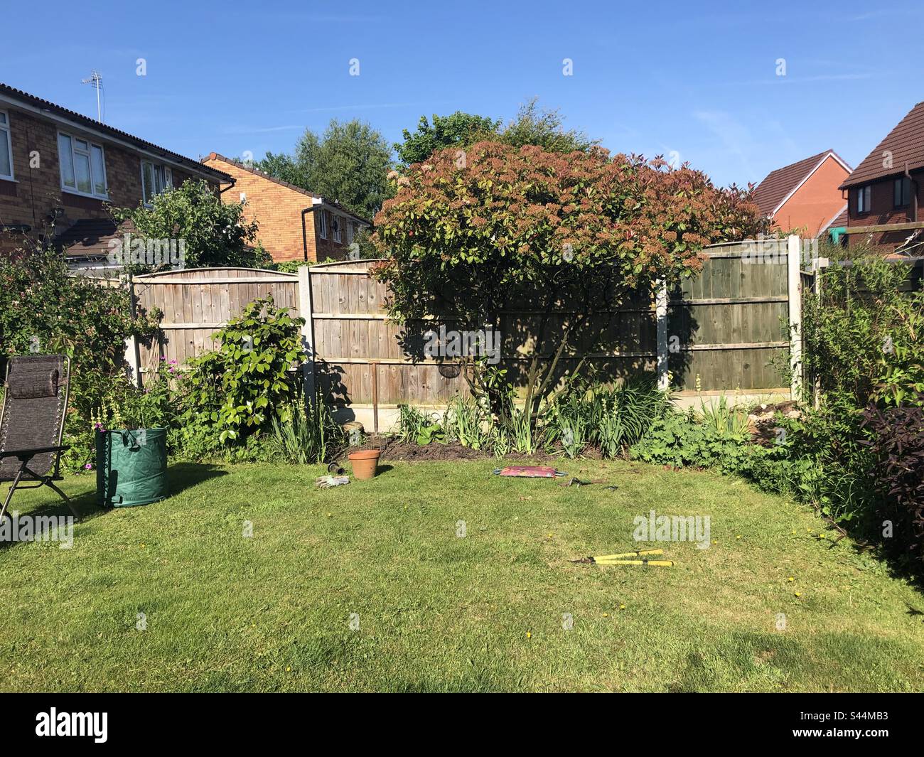 Getting the garden done Stock Photo Alamy