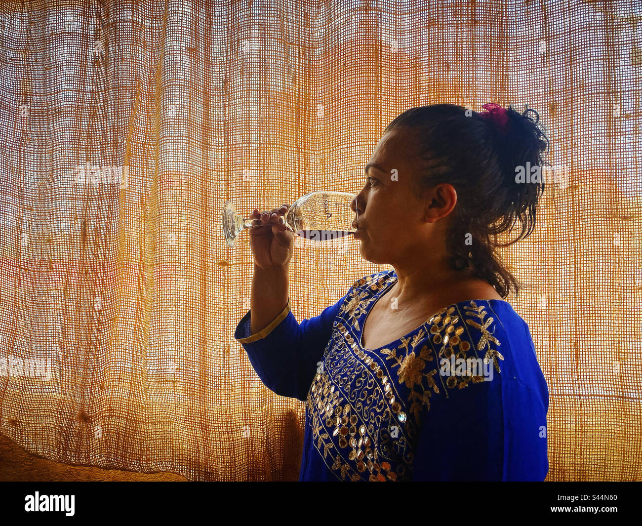 A female woman drinks wine in Bothe winery in Villa Progreso, Queretaro, Mexico Stock Photo