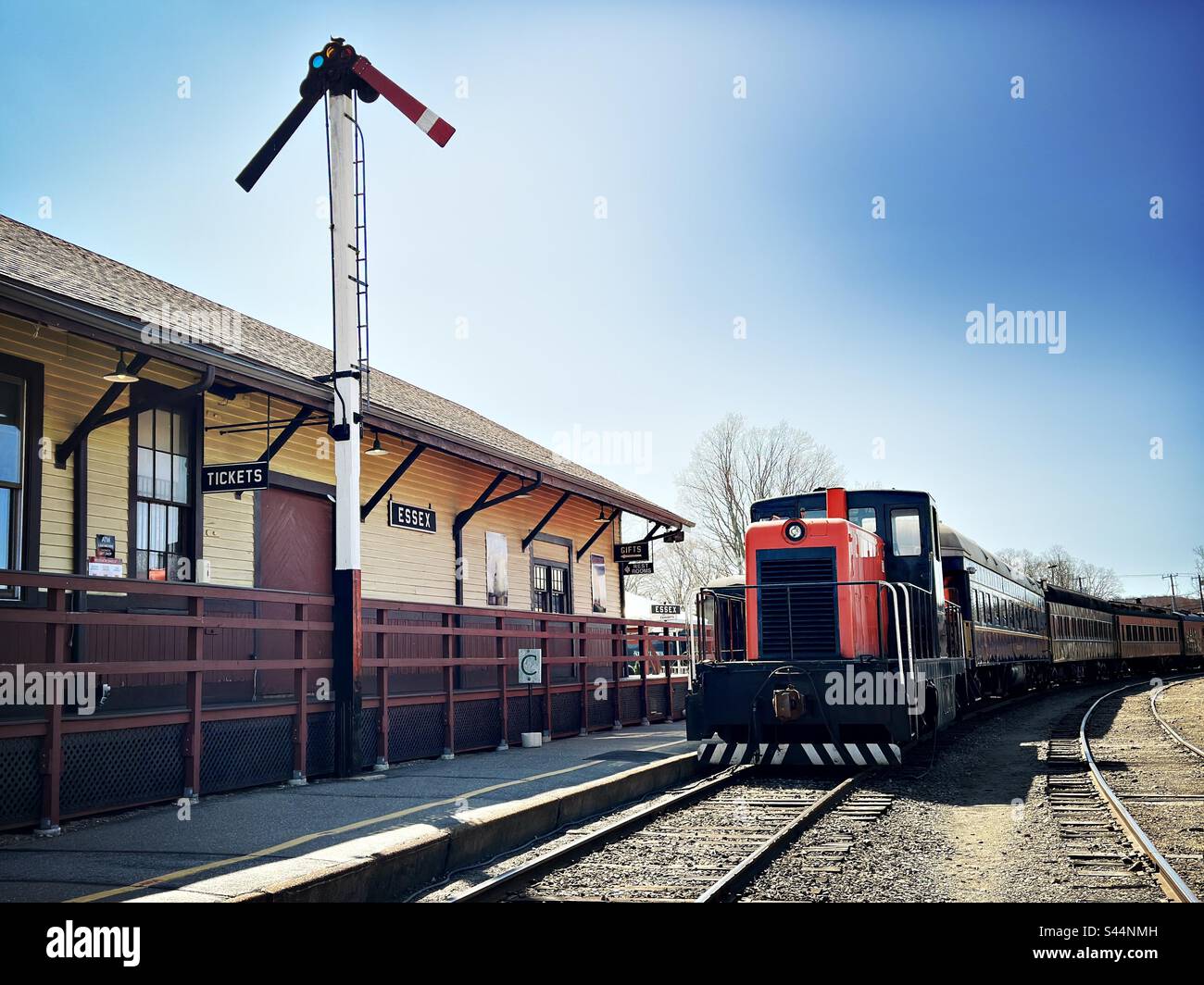 Train at Essex Steam Train museum in Essex, Connecticut. Old fashion, train station with ticket booth. - Smartphone Captured Stock Image