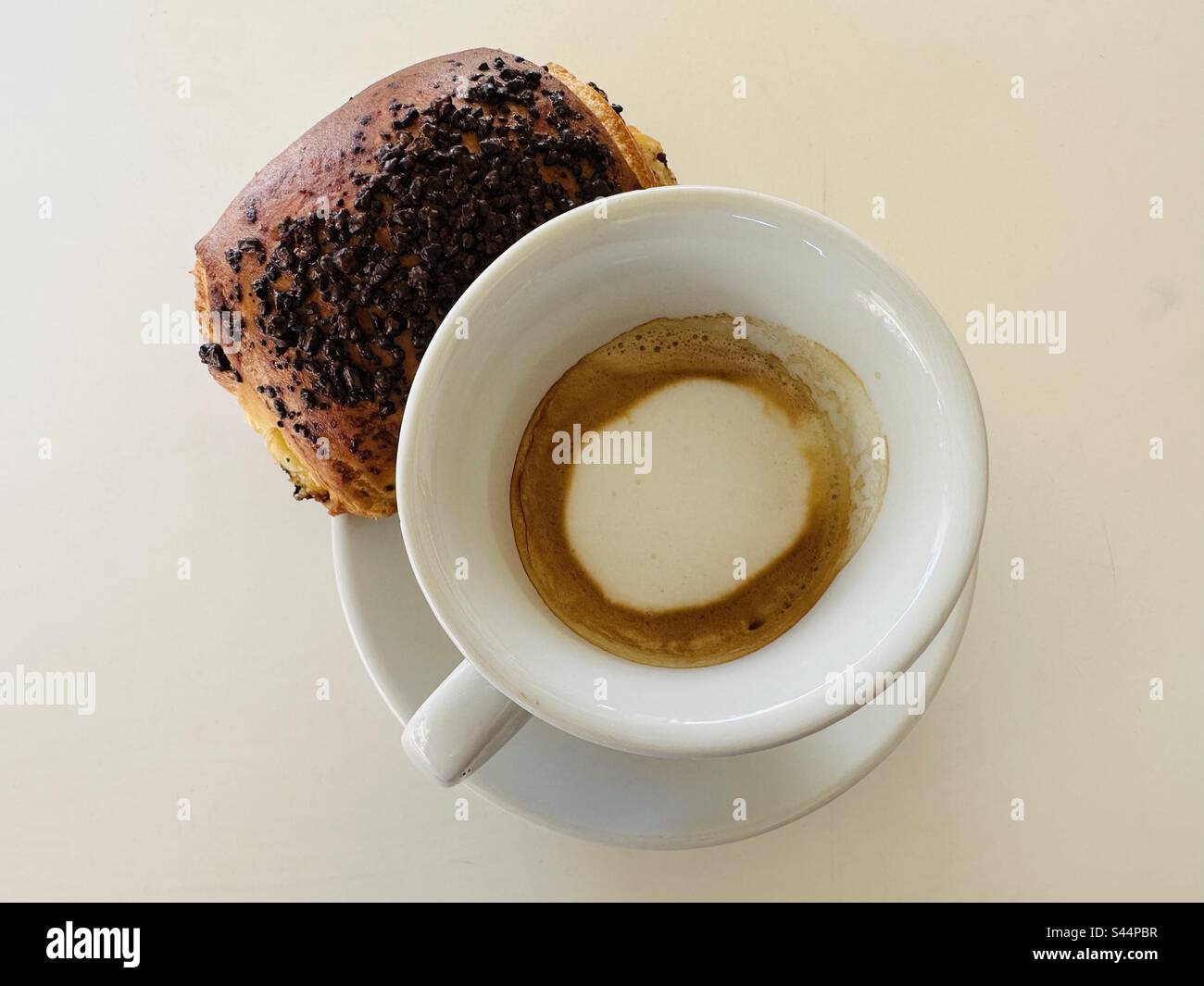 Breakfast time with espresso coffee and milk with a chocolate pastry Stock Photo