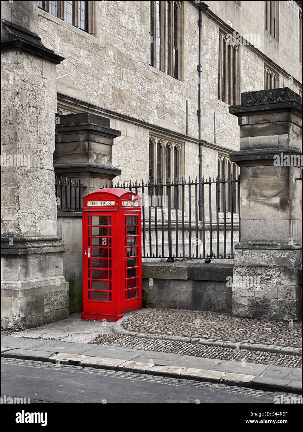 An iconic British Red Telephone Box - Call Box - used in the 20th Century as a way of making landline calls by the general public. Superseded by the mobile/cell phone. Photo ©️ COLIN HOSKINS. - Smartphone Captured Stock Image